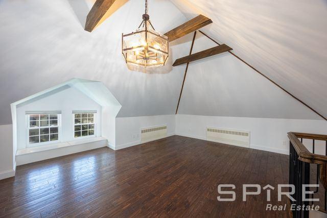 72-03 Ingram St Unit H0Use, New York City, NY 11375 - bonus room featuring radiator heating unit, wood finished floors, a chandelier, and baseboards