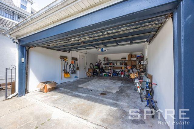 72-03 Ingram St Unit H0Use, New York City, NY 11375 - garage featuring a garage door opener