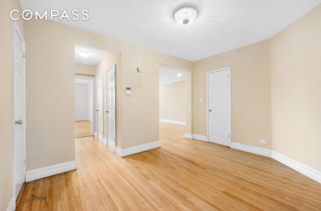 34-41 85th St Unit 4R, New York City, NY 11372 - spare room featuring light wood-style floors and baseboards
