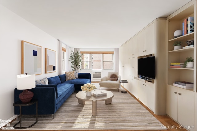 living area featuring a wall mounted AC