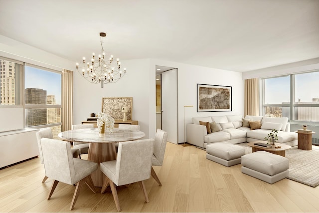 146 W 57th St Unit 53A, New York City, NY 10019 - dining room with a chandelier and light wood-style flooring
