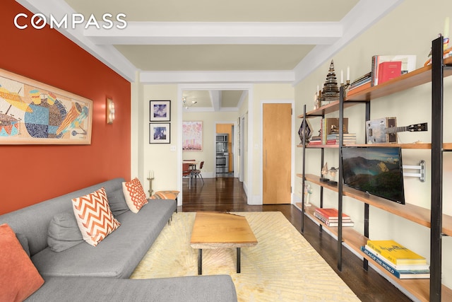 living area featuring wood finished floors and beam ceiling