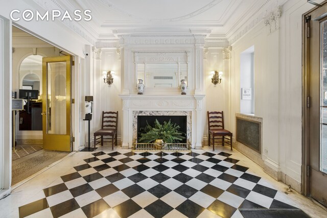 1349 Lexington Ave Unit 1F, New York City, NY 10128 - living room with crown molding and a premium fireplace