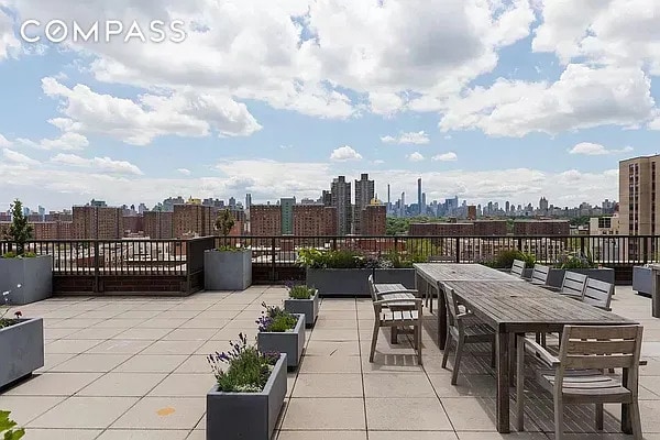 1485 5th Ave Unit 13D, New York City, NY 10035 - view of patio / terrace featuring a view of skyline and outdoor dining area