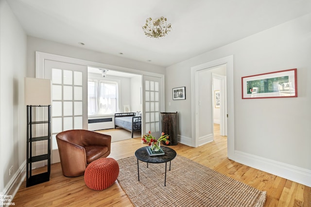 878 W End Ave Unit 16Cd, New York City, NY 10025 - sitting room featuring baseboards, light wood-type flooring, and radiator
