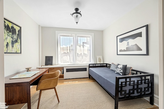 878 W End Ave Unit 16Cd, New York City, NY 10025 - bedroom featuring radiator, wood finished floors, and an office area