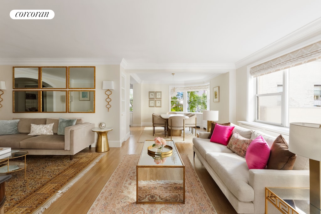 1025 5th Ave Unit 4Sa, New York City, NY 10028 - living area with ornamental molding, light wood-style floors, and baseboards