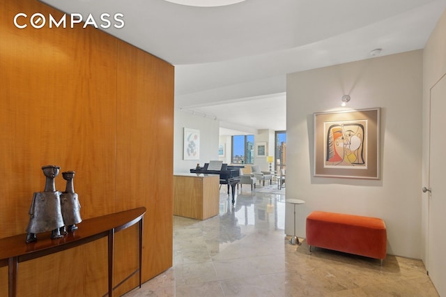 hallway with light marble finish floors