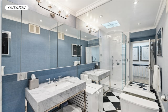 132 E 62nd St, New York City, NY 10065 - full bathroom featuring toilet, crown molding, a sink, and a stall shower