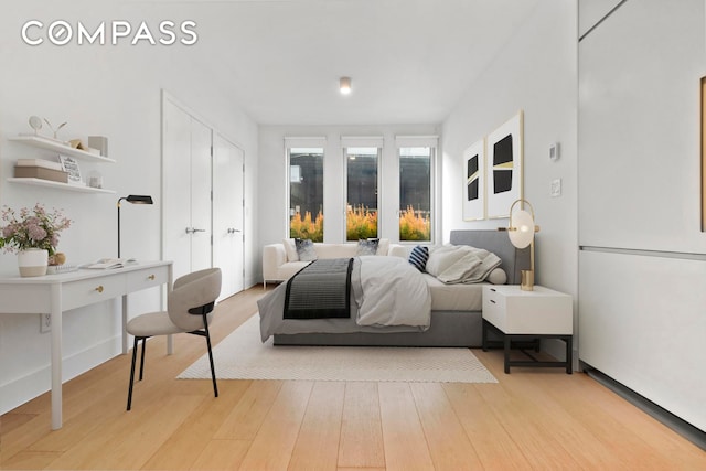 bedroom featuring light wood-type flooring