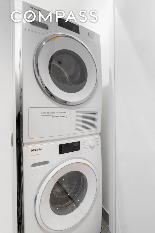 laundry room with laundry area and stacked washing maching and dryer