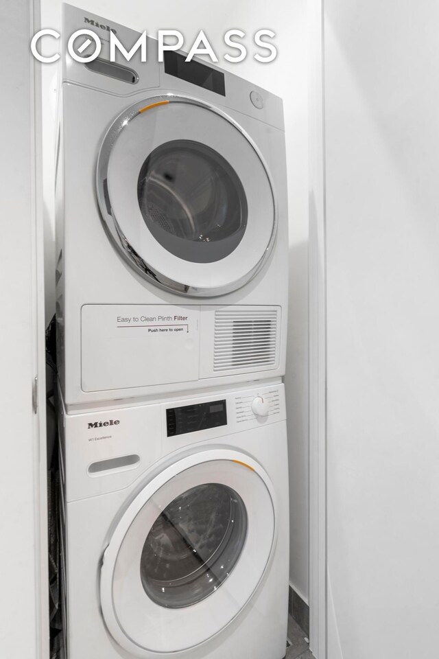 208 Delancey St Unit Gc, New York City, NY 10002 - laundry room with stacked washer and clothes dryer