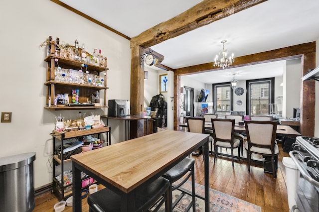 dining room featuring beam ceiling, hardwood / wood-style flooring, and a notable chandelier