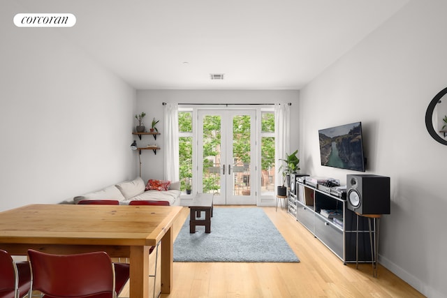146 Clifton Pl Unit 2A, New York City, NY 11238 - living area featuring light wood-style flooring, french doors, and baseboards