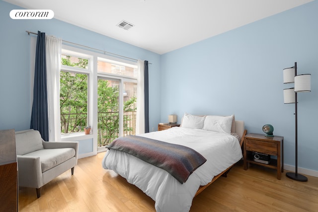 146 Clifton Pl Unit 2A, New York City, NY 11238 - bedroom featuring access to outside, light wood-style floors, and baseboards