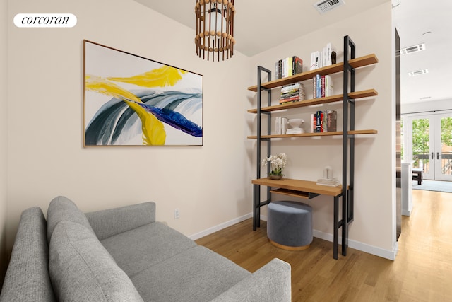 146 Clifton Pl Unit 2A, New York City, NY 11238 - living area with wood finished floors, baseboards, and a chandelier