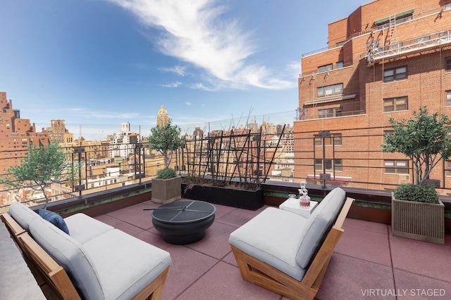 view of patio / terrace with a city view and a balcony