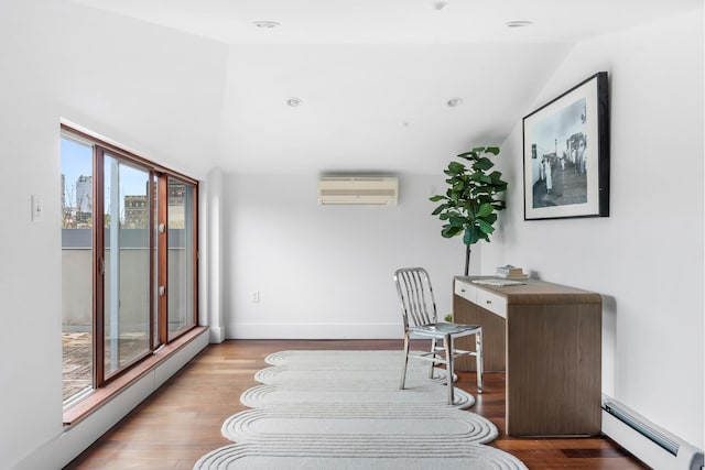 268 Cumberland St Unit 4A, New York City, NY 11205 - office space featuring baseboard heating, an AC wall unit, vaulted ceiling, wood finished floors, and a baseboard heating unit