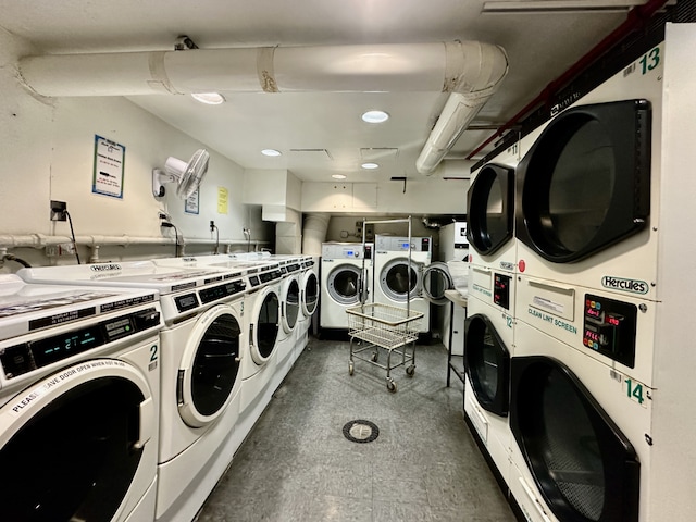 shared laundry room with stacked washer / drying machine and washing machine and dryer