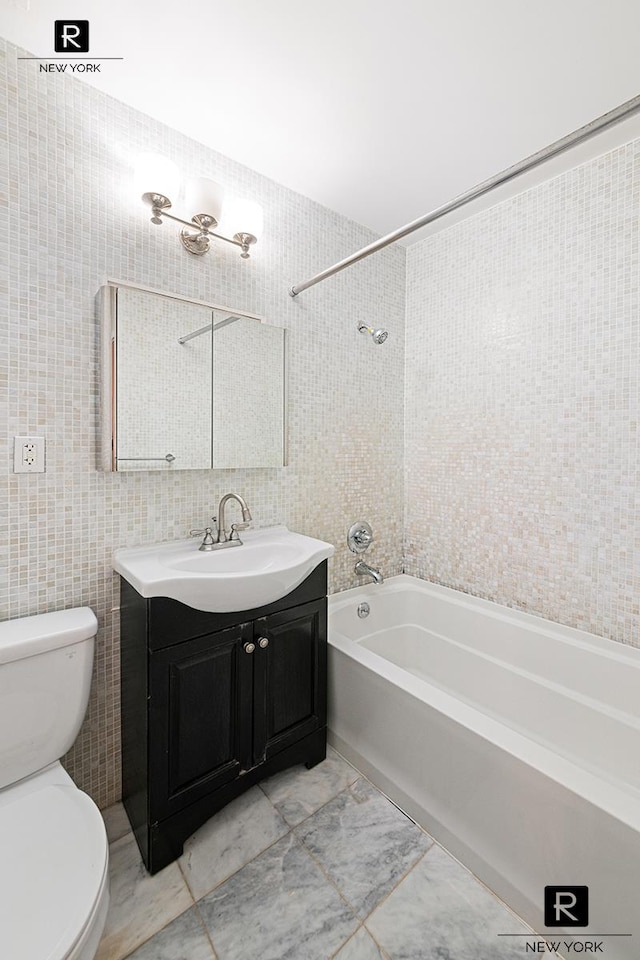 315 7th Ave Unit 16-D, New York City, NY 10001 - full bathroom featuring tile walls, toilet, shower / tub combination, vanity, and decorative backsplash