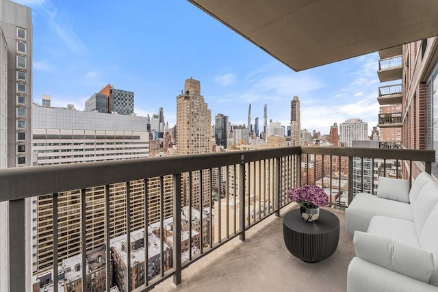 422 E 72nd St Unit 25C, New York City, NY 10021 - balcony featuring a view of skyline and an outdoor living space