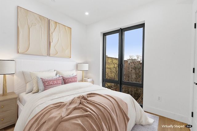 45-29 47th St Unit 2-B, New York City, NY 11377 - bedroom with wood finished floors, recessed lighting, and baseboards