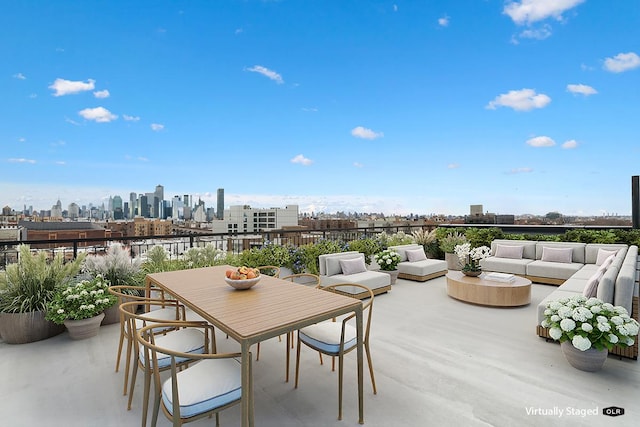 45-29 47th St Unit 2-B, New York City, NY 11377 - view of patio / terrace with an outdoor living space, a view of skyline, outdoor dining area, and a balcony