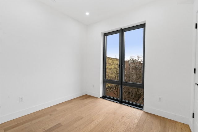 45-29 47th St Unit 3-A, New York City, NY 11377 - unfurnished room with baseboards, wood finished floors, and recessed lighting