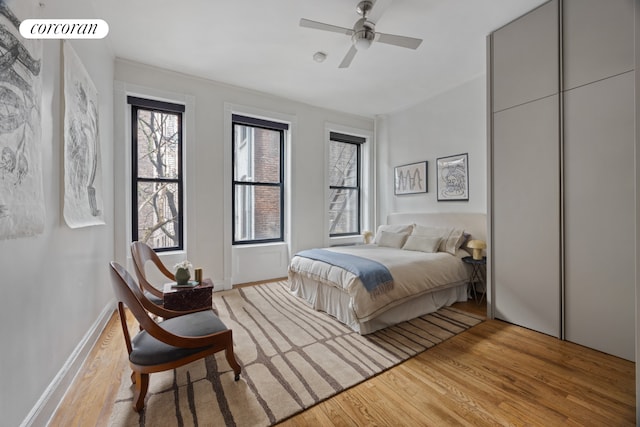 855 9th Ave Unit 1B, New York City, NY 10019 - bedroom featuring light wood-style floors and a ceiling fan