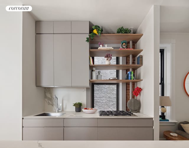 855 9th Ave Unit 1B, New York City, NY 10019 - bar area featuring a sink and stainless steel gas cooktop