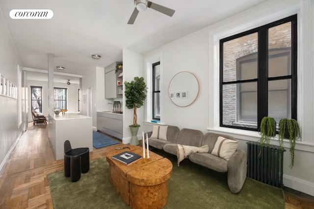 855 9th Ave Unit 1B, New York City, NY 10019 - living room featuring a ceiling fan and baseboards