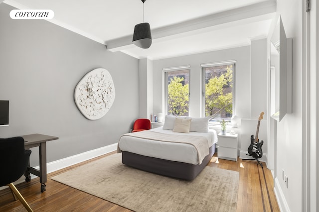 1200 5th Ave Unit 2A, New York City, NY 10029 - bedroom with wood finished floors, an office area, crown molding, baseboards, and beamed ceiling