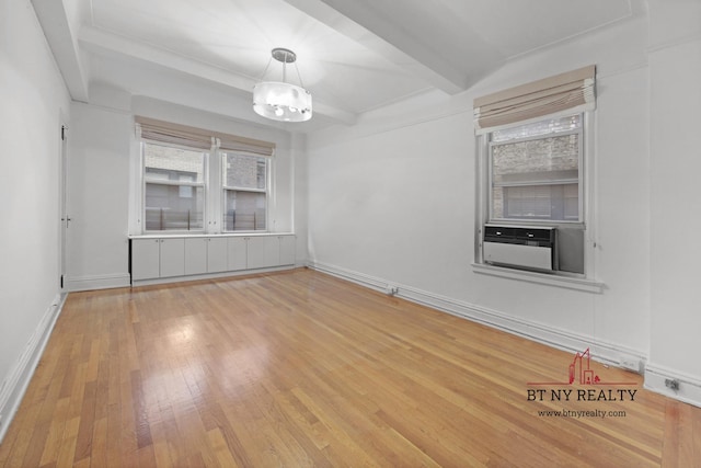 50 Riverside Dr Unit 11-F, New York City, NY 10024 - unfurnished dining area featuring wood finished floors, a chandelier, baseboards, and beamed ceiling