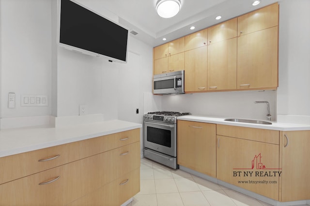50 Riverside Dr Unit 11-F, New York City, NY 10024 - kitchen with appliances with stainless steel finishes, a sink, light brown cabinetry, recessed lighting, and light countertops