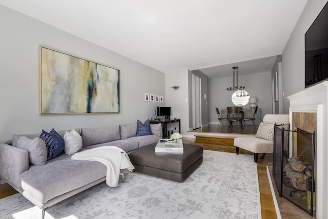301 E 48th St Unit 14J, New York City, NY 10017 - living room with wood finished floors and a premium fireplace