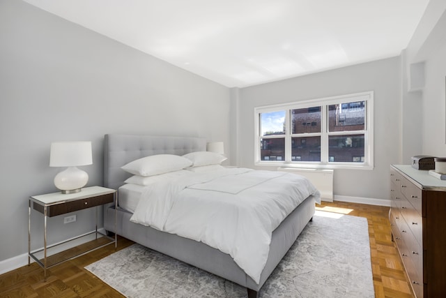 301 E 48th St Unit 14J, New York City, NY 10017 - bedroom with baseboards