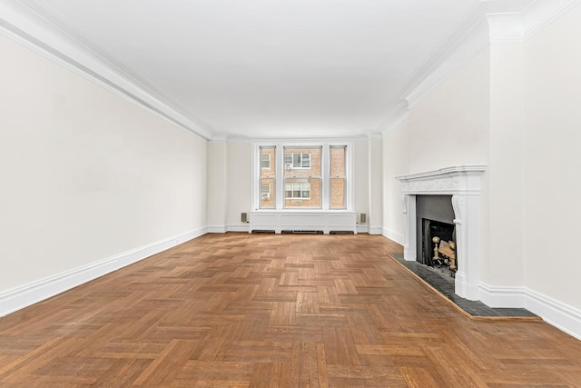 unfurnished living room featuring crown molding, baseboards, and a fireplace