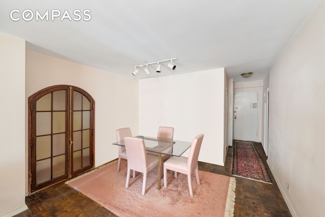 345 E 56th St Unit 5C, New York City, NY 10022 - dining room with arched walkways and rail lighting