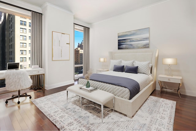 bedroom featuring crown molding, baseboards, and wood finished floors