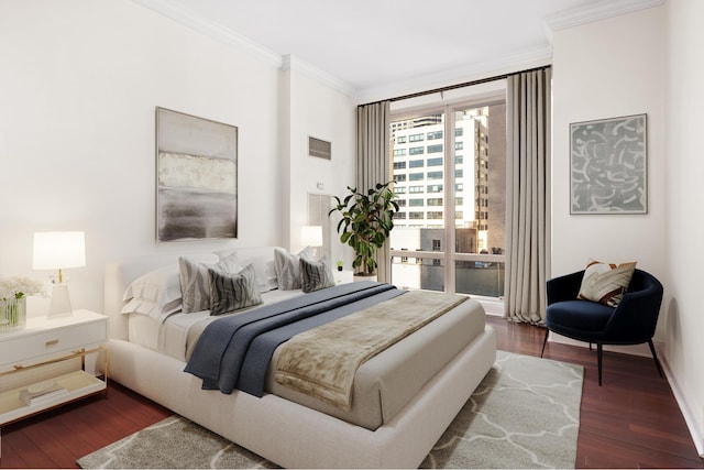 bedroom with ornamental molding, dark wood-style flooring, and visible vents