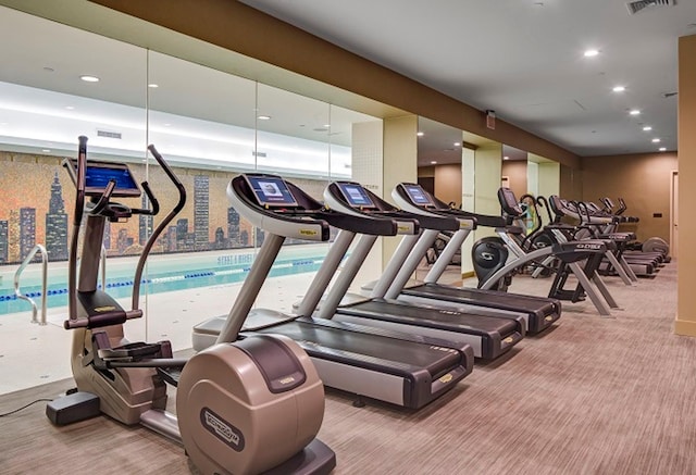 workout area with carpet flooring, recessed lighting, and visible vents