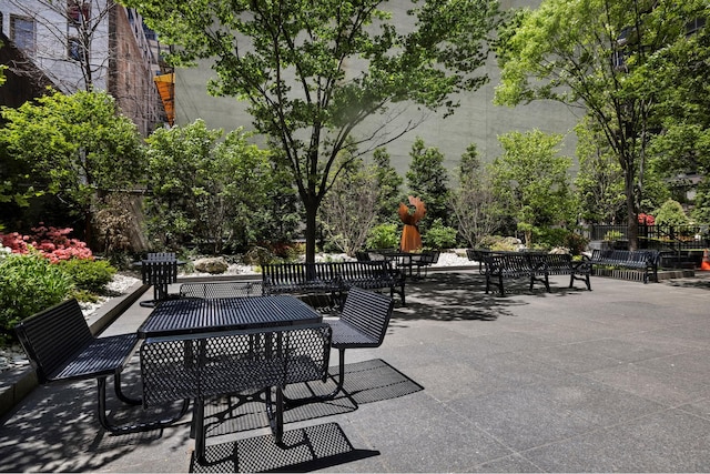 view of patio with fence and outdoor dining area
