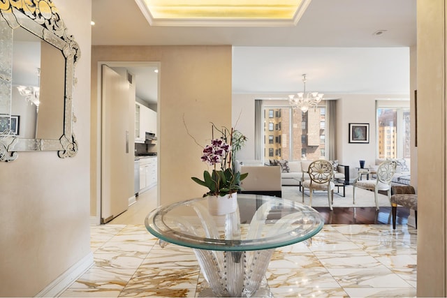 corridor featuring baseboards, visible vents, marble finish floor, and a notable chandelier