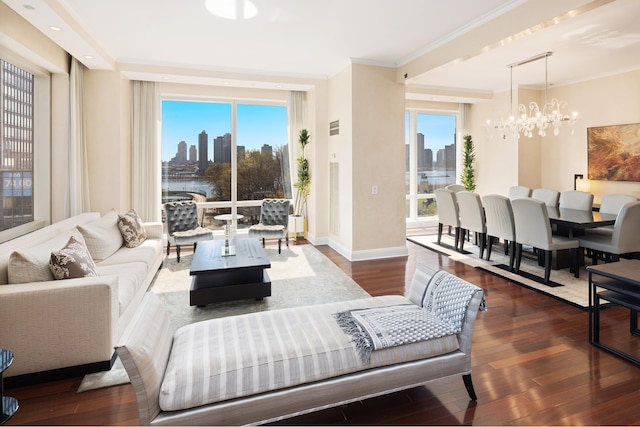 living area featuring a view of city, a chandelier, hardwood / wood-style floors, and ornamental molding