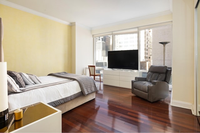 bedroom with baseboards, ornamental molding, and hardwood / wood-style floors