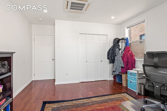 office area with recessed lighting, wood finished floors, visible vents, and baseboards