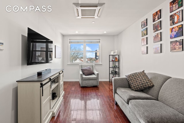 interior space with baseboards, recessed lighting, and dark wood-style flooring