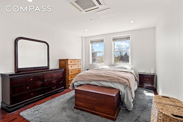 bedroom featuring visible vents, dark wood-style floors, and recessed lighting