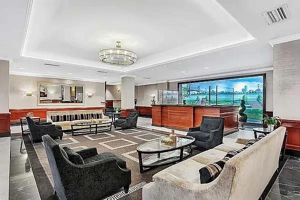 45 Sutton Pl S Unit 11K, New York City, NY 10022 - common area featuring a wainscoted wall and recessed lighting