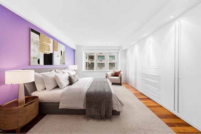 bedroom featuring wood finished floors and recessed lighting